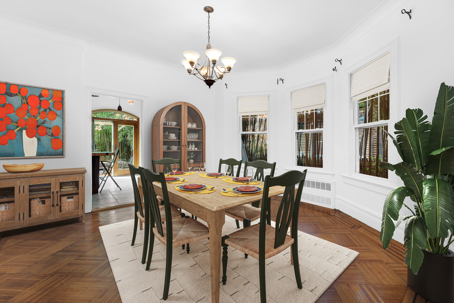 242 Stratford Road Brooklyn, NY 11218 - Photo 6 of 27 a view of a dining room with furniture a chandelier and wooden floor
