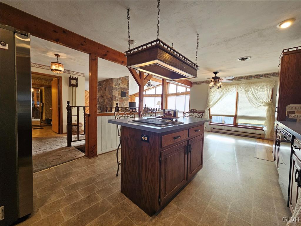 800 Copella Road Bath, PA 18014 - Photo 14 of 43 a kitchen with stainless steel appliances granite countertop a sink a stove top oven a chimney and a center island