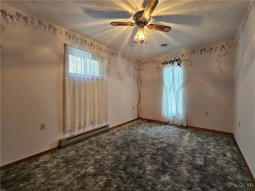 800 Copella Road Bath, PA 18014 - Photo 23 of 43 an empty room with windows and fan