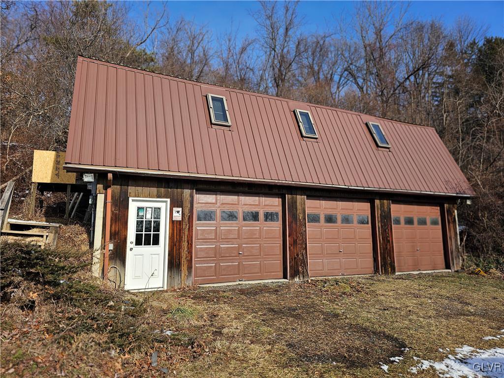800 Copella Road Bath, PA 18014 - Photo 9 of 43 a front view of a house with garage