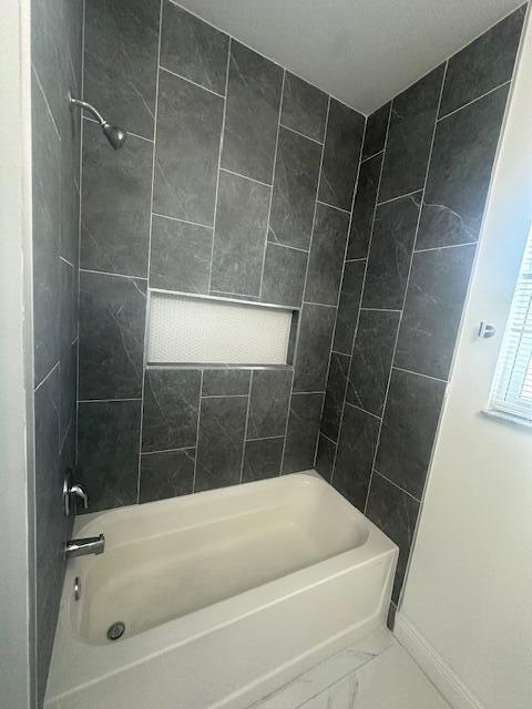1726 Southwest California Boulevard Port St. Lucie, FL 34953 - Photo 18 of 41 a bath tub sitting next to a shower