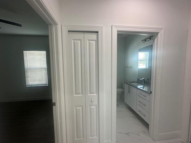 1726 Southwest California Boulevard Port St. Lucie, FL 34953 - Photo 19 of 41 view of a bathroom from the hallway