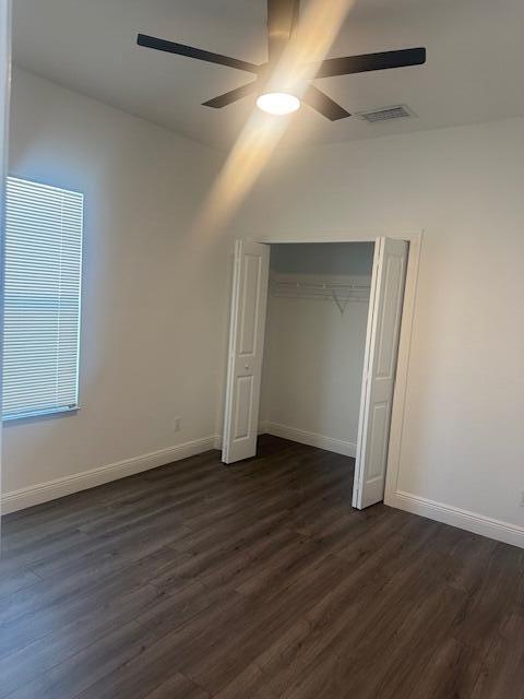 1726 Southwest California Boulevard Port St. Lucie, FL 34953 - Photo 27 of 41 an empty room with wooden floor and closet