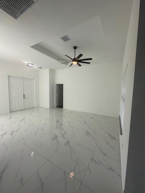 1726 Southwest California Boulevard Port St. Lucie, FL 34953 - Photo 29 of 41 a view of a livingroom and a ceiling fan