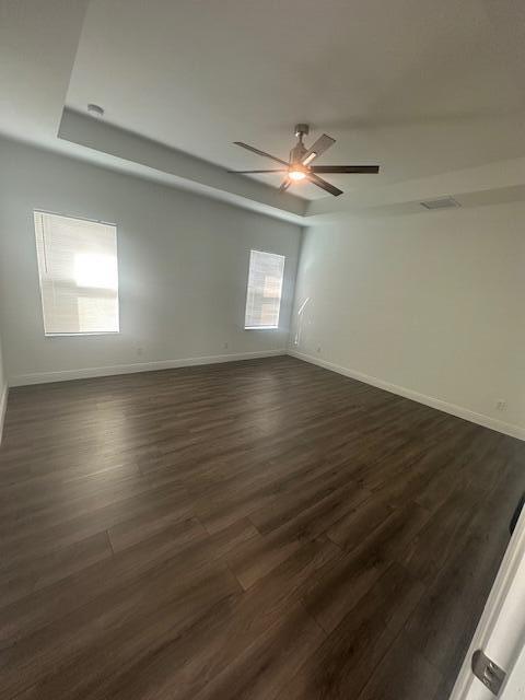 1726 Southwest California Boulevard Port St. Lucie, FL 34953 - Photo 30 of 41 an empty room with wooden floor chandelier fan and windows