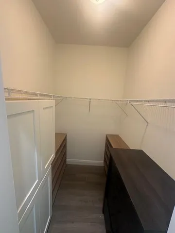 a view of storage and utility room with racks on the wall