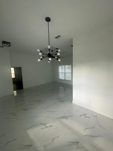 1726 Southwest California Boulevard Port St. Lucie, FL 34953 - Photo 5 of 41 a view of a room with a ceiling fan dryer and washer