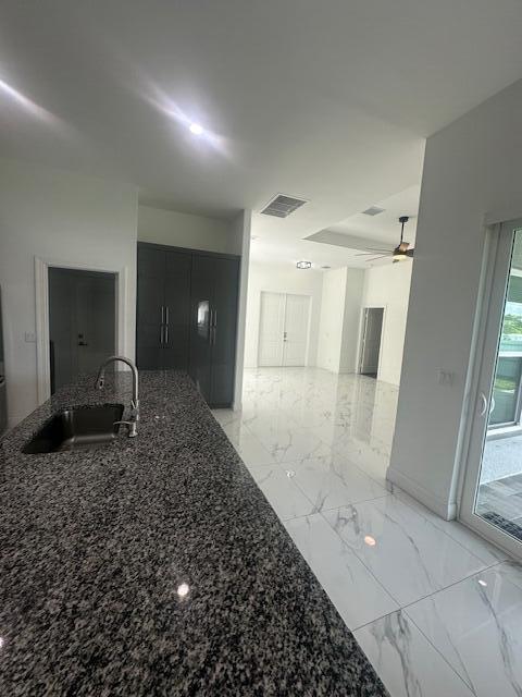 1726 Southwest California Boulevard Port St. Lucie, FL 34953 - Photo 10 of 41 a bathroom with a sink and a mirror