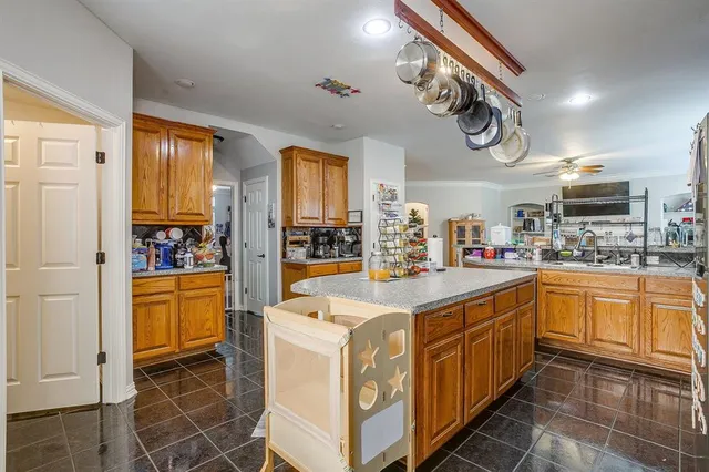 a utility room with fridge dryer and washer