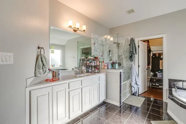 a dining room with a table and chairs