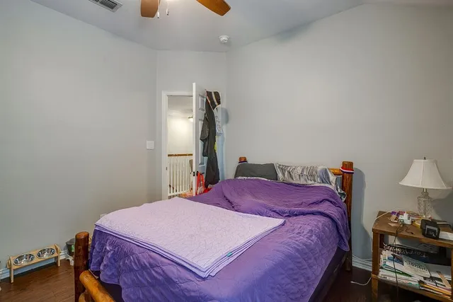 a bedroom with furniture and a chandelier