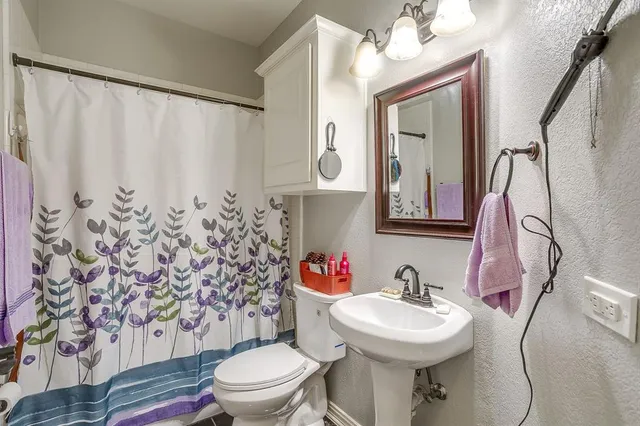 a bedroom with bed and a window