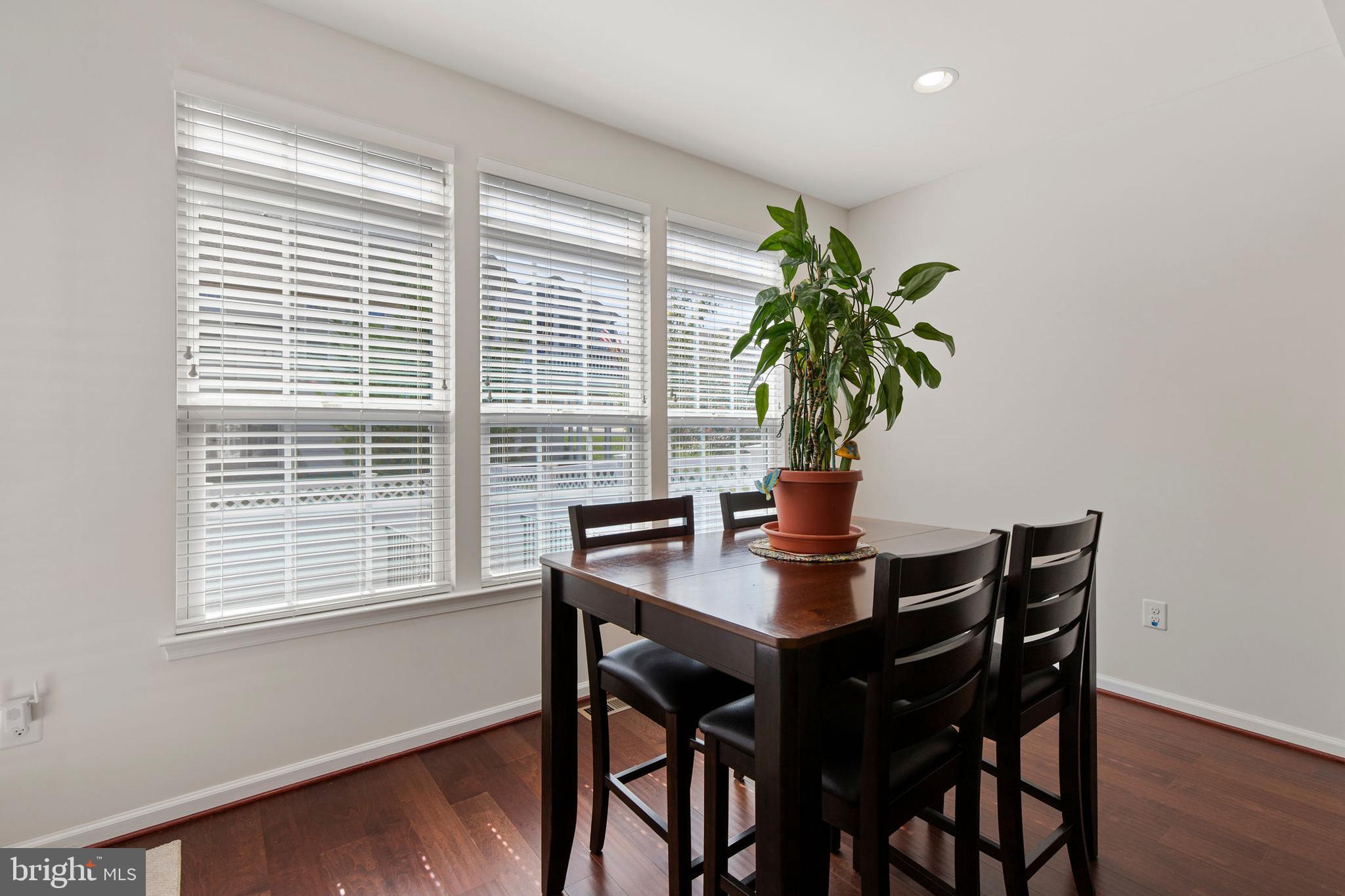 371 Tufton Circle Fallston, MD 21047 - Photo 16 of 47 a view of a workspace with a table and a potted plant