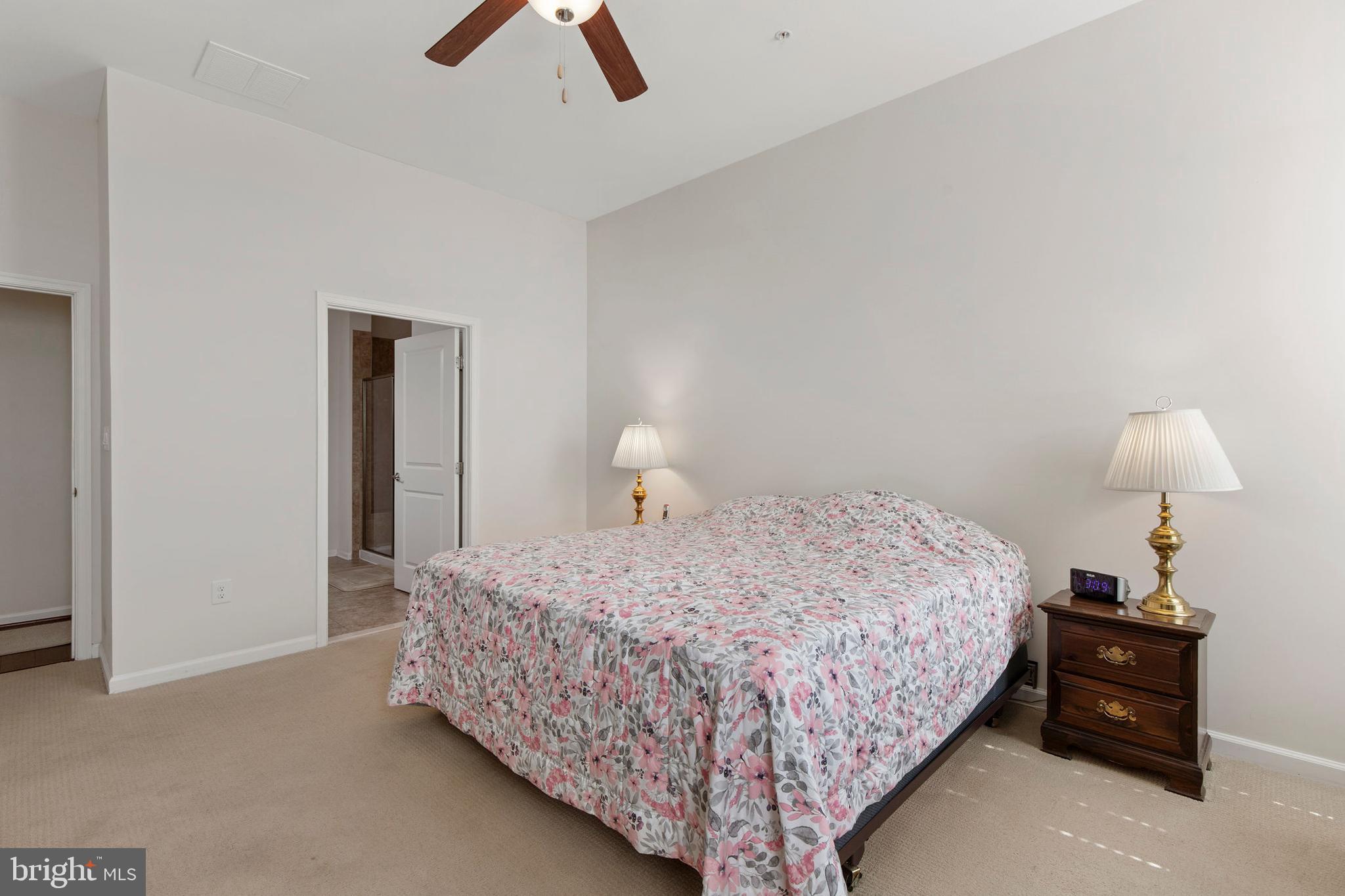 371 Tufton Circle Fallston, MD 21047 - Photo 21 of 47 a bedroom with a bed and a lamp