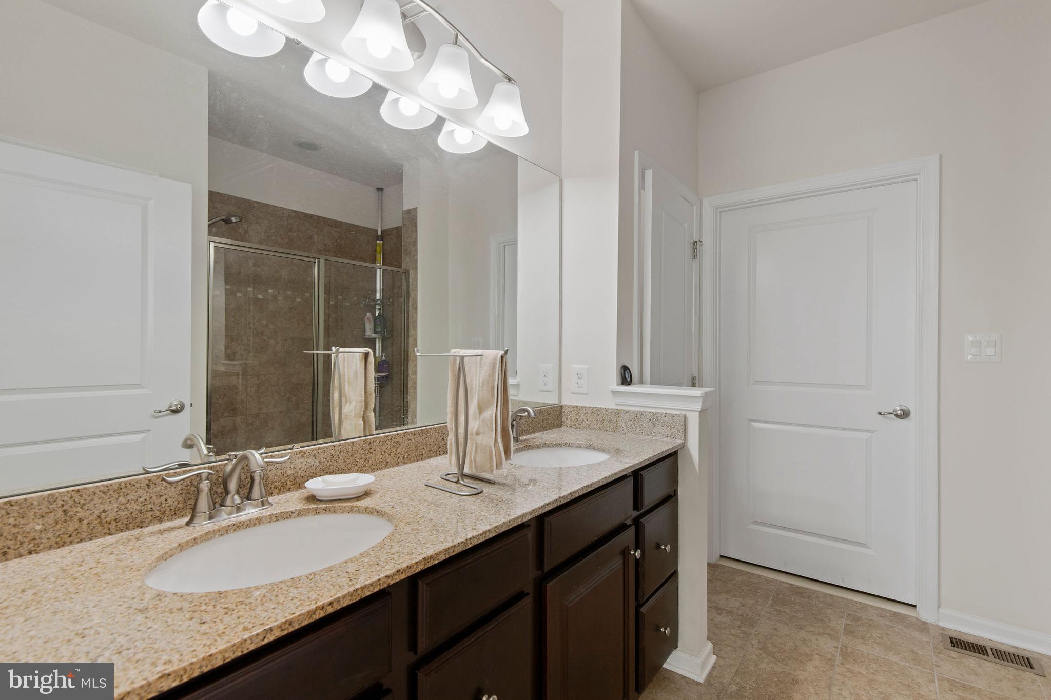 371 Tufton Circle Fallston, MD 21047 - Photo 22 of 47 a bathroom with a granite countertop double vanity sink and a mirror