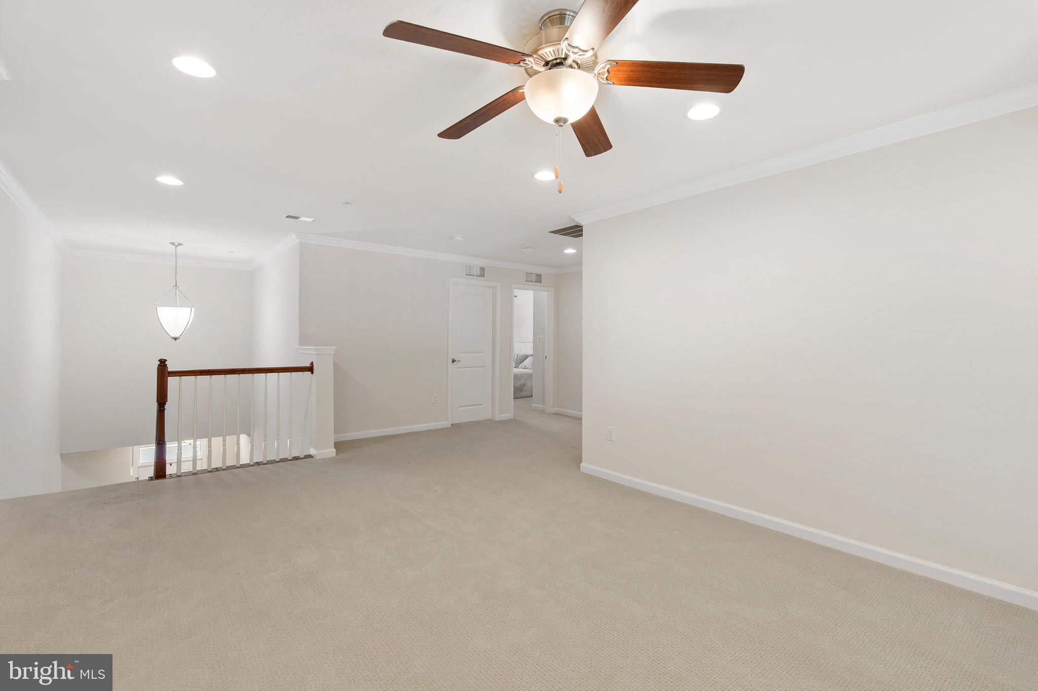 371 Tufton Circle Fallston, MD 21047 - Photo 27 of 47 an empty room with chandelier fan and closet area