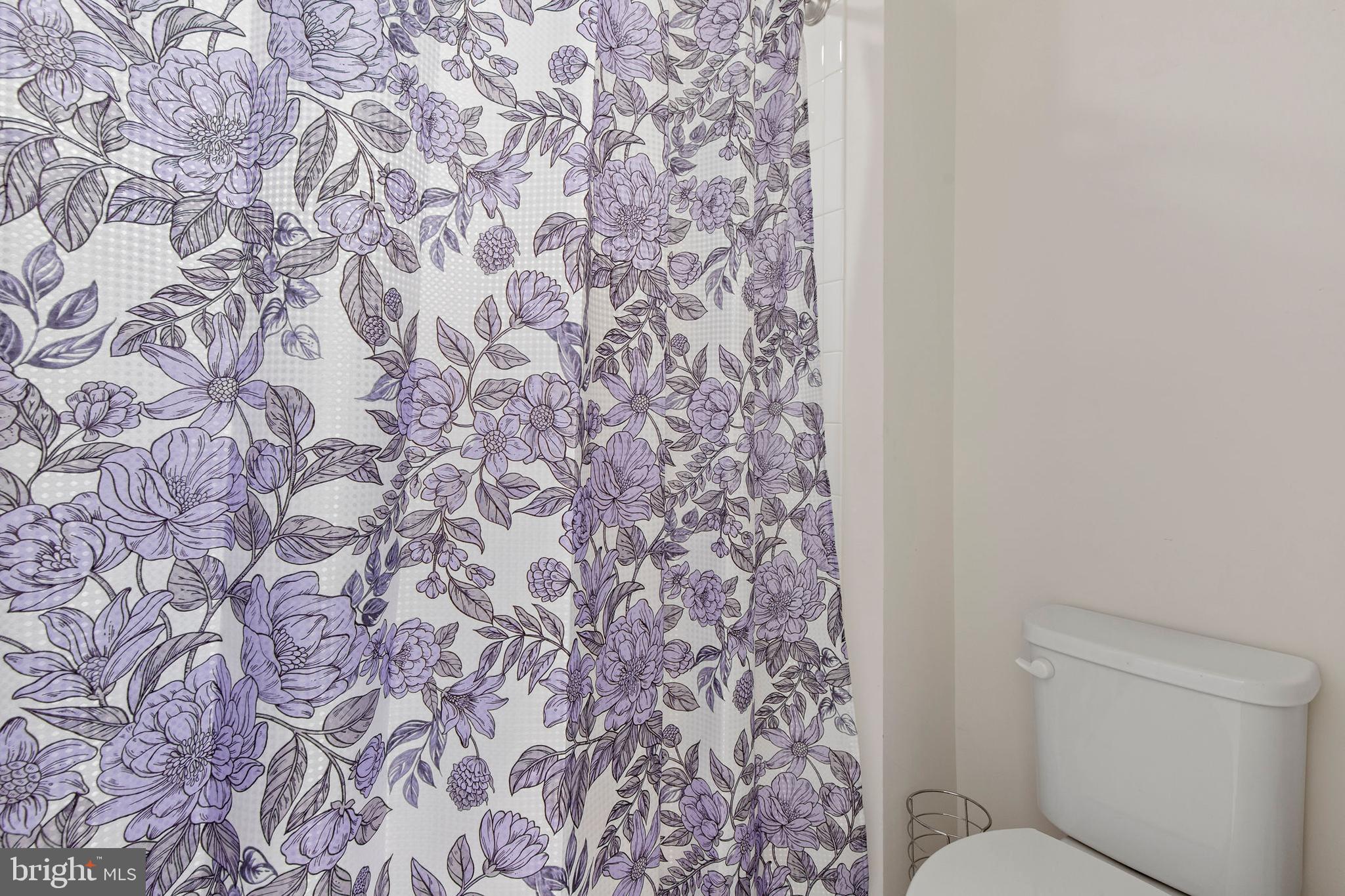 371 Tufton Circle Fallston, MD 21047 - Photo 35 of 47 a bathroom with a toilet and a shower curtain