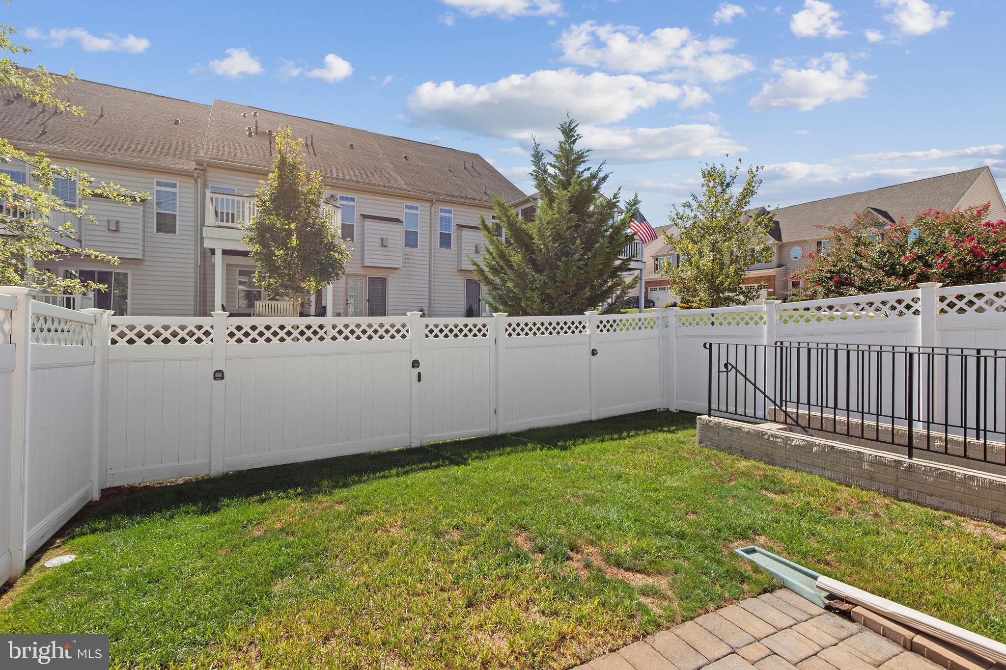 371 Tufton Circle Fallston, MD 21047 - Photo 39 of 47 a view of a white house with a yard and wooden fence