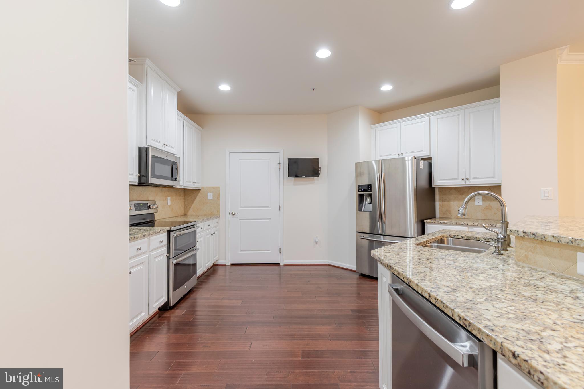 371 Tufton Circle Fallston, MD 21047 - Photo 6 of 47 a kitchen with refrigerator cabinets and microwave