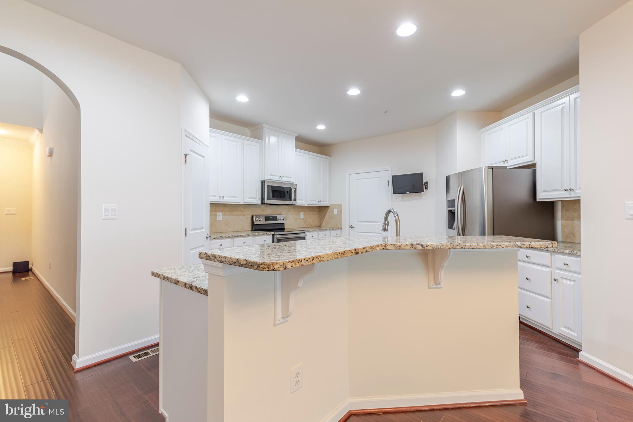 371 Tufton Circle Fallston, MD 21047 - Photo 7 of 47 a kitchen with stainless steel appliances a refrigerator sink and microwave