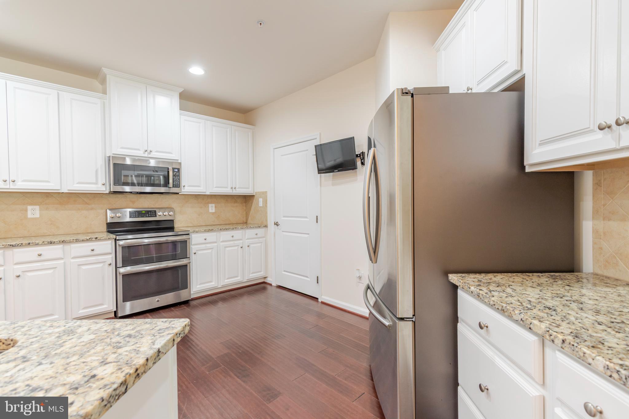 371 Tufton Circle Fallston, MD 21047 - Photo 9 of 47 a kitchen with granite countertop a refrigerator stove and oven