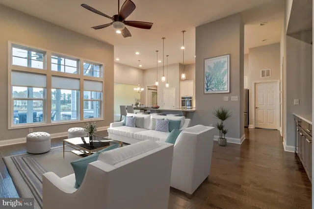 a kitchen with kitchen island a sink stove and oven