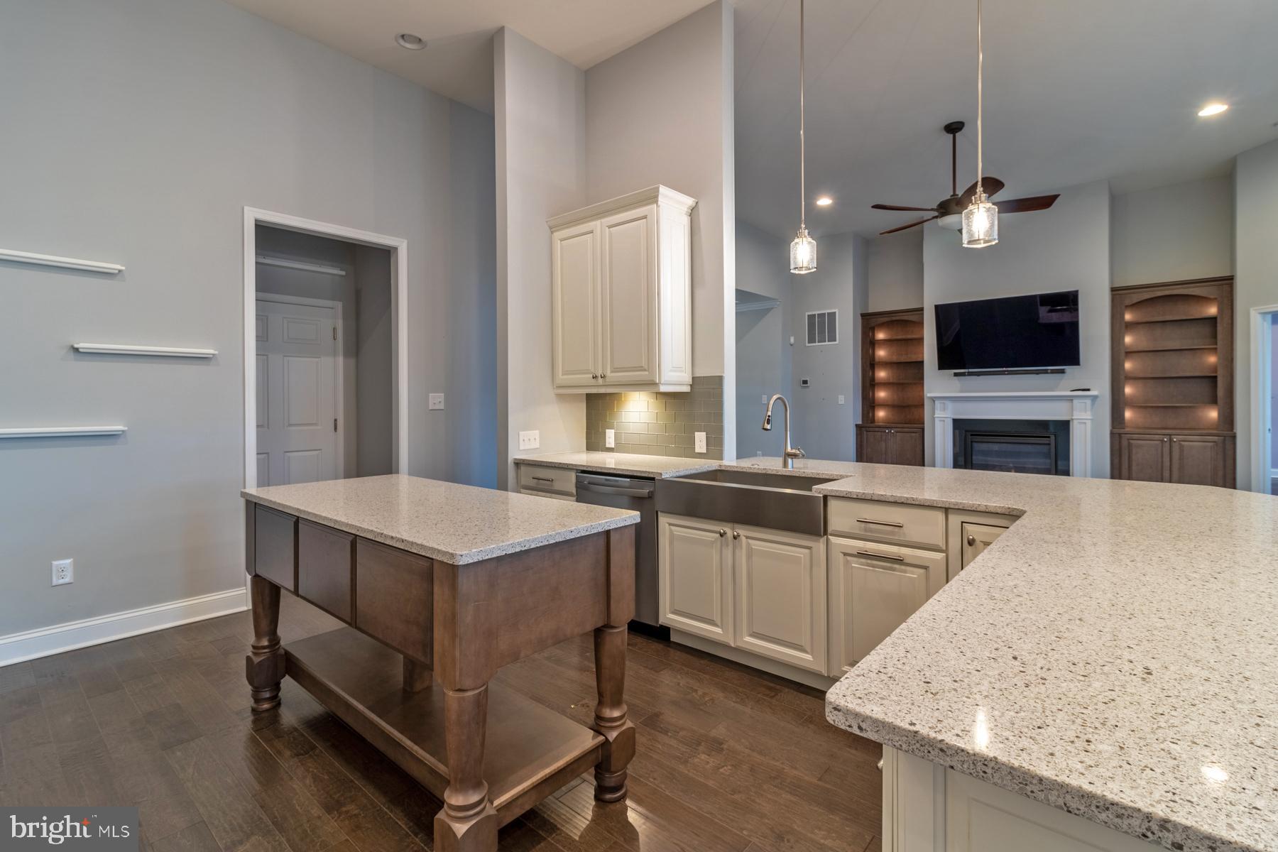 36885 Crossrail Way Lewes, DE 19958 - Photo 15 of 70 a kitchen with kitchen island a sink stove and oven