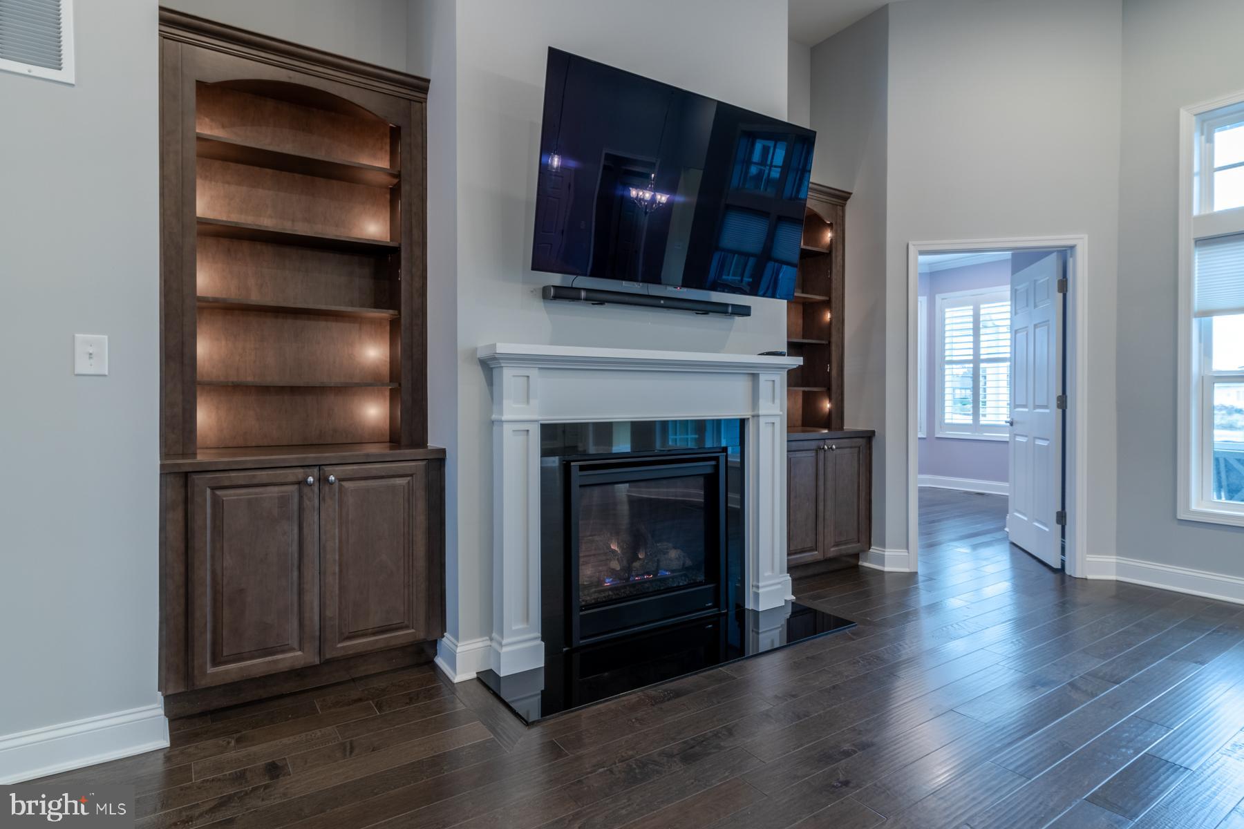 36885 Crossrail Way Lewes, DE 19958 - Photo 24 of 70 a living room with furniture and a fireplace