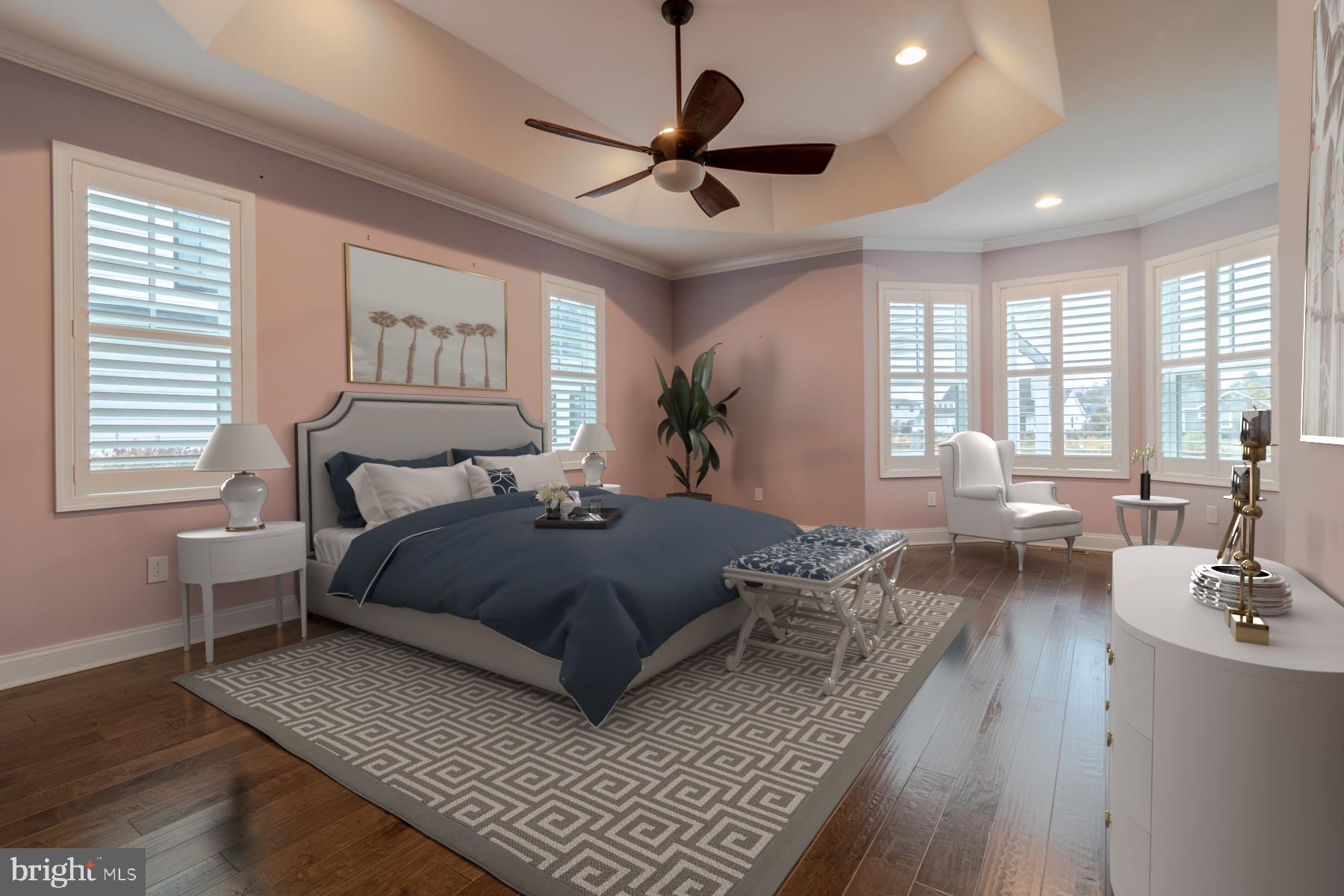 36885 Crossrail Way Lewes, DE 19958 - Photo 26 of 70 a spacious bedroom with a bed a couch and a large window