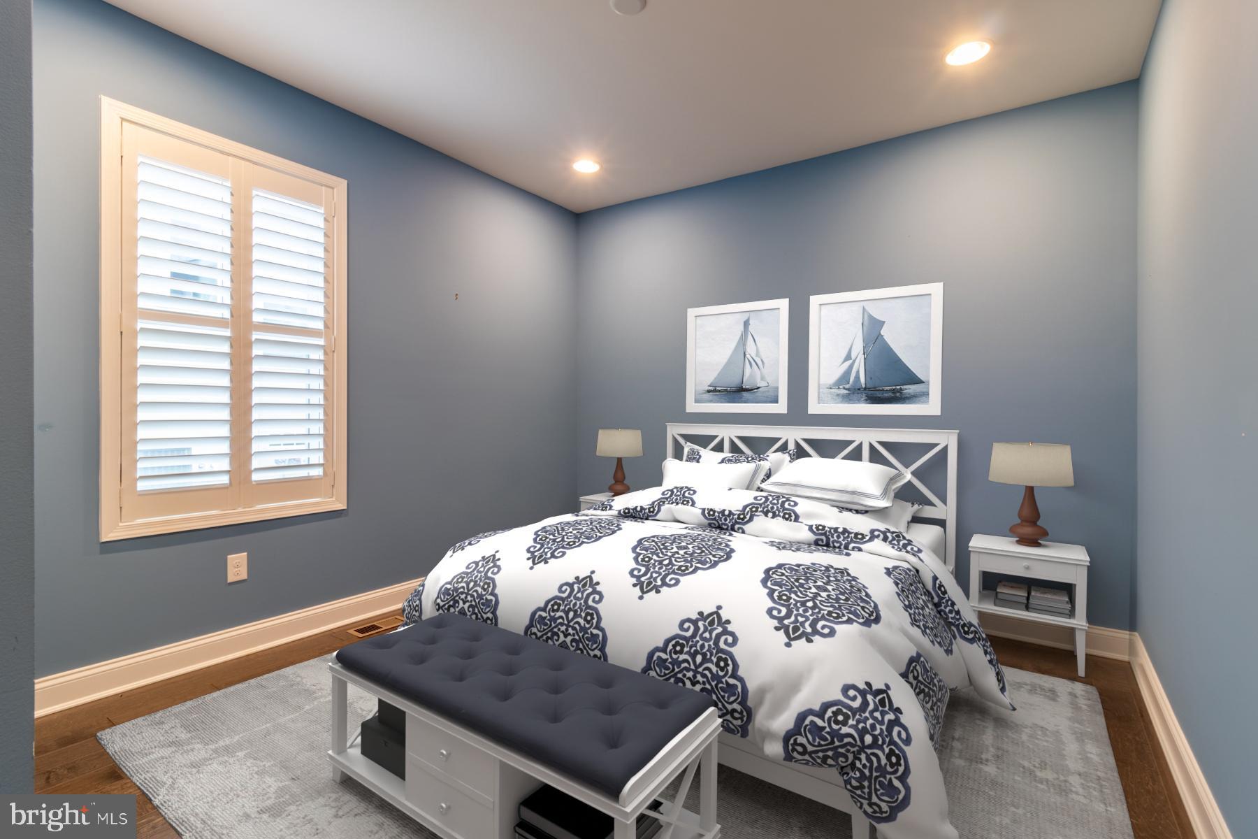 36885 Crossrail Way Lewes, DE 19958 - Photo 36 of 70 a bedroom with a bed and a table in it