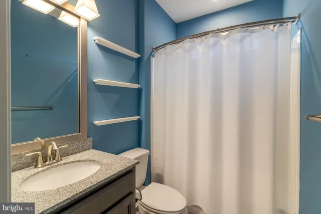 a view of a bathroom with a sink and a window