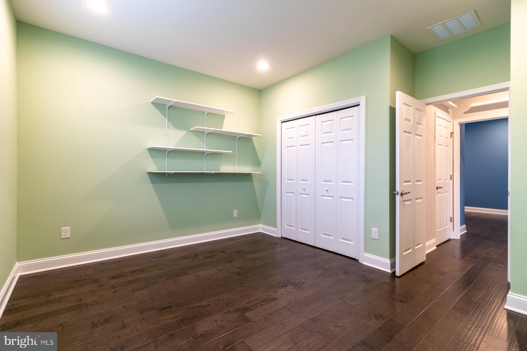36885 Crossrail Way Lewes, DE 19958 - Photo 41 of 70 a view of a room with wooden floor and cabinet