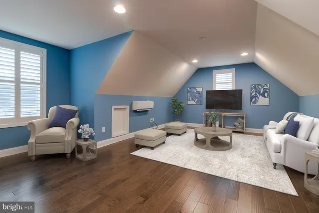 a view of a cars park in front of a building