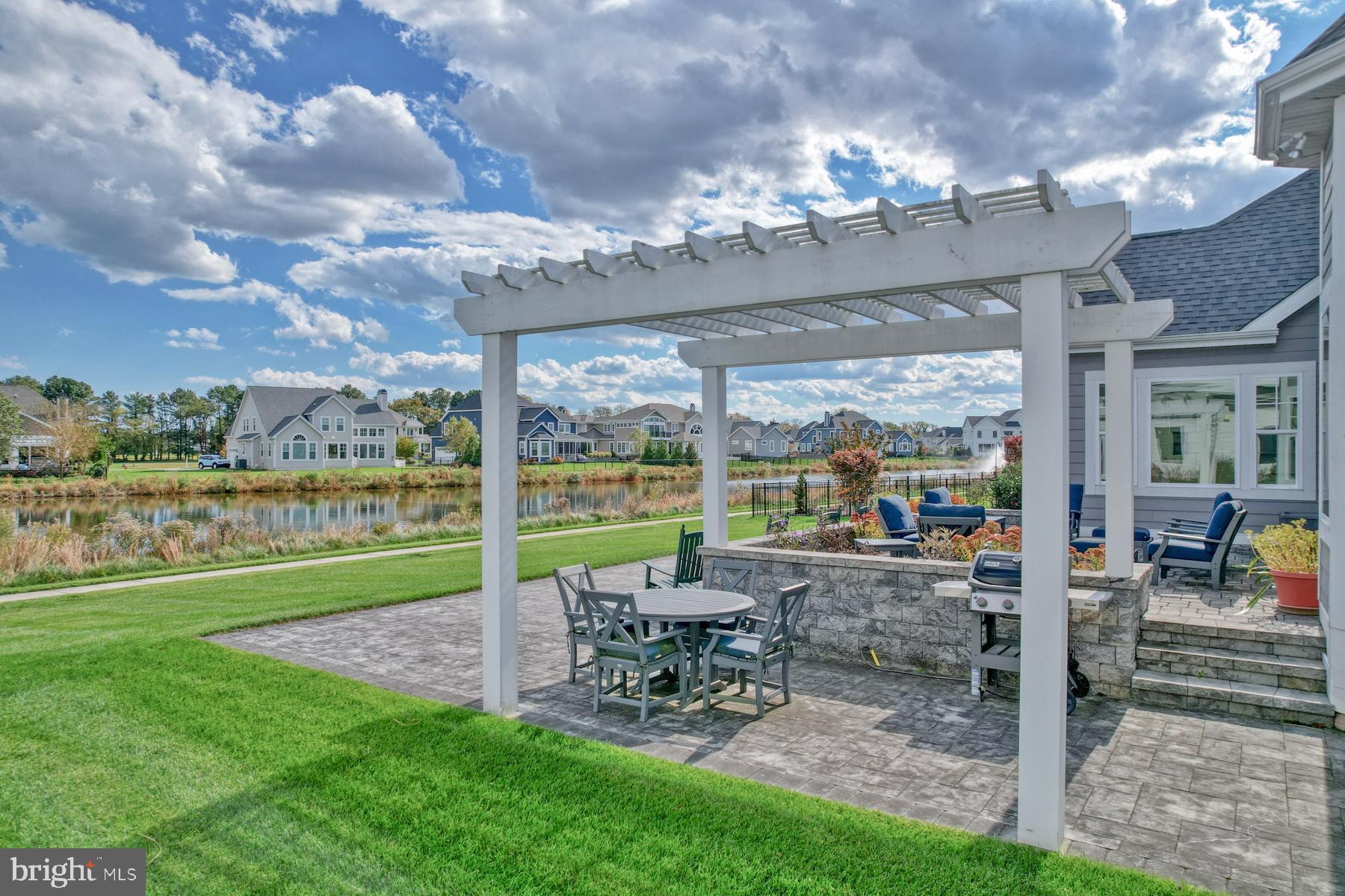 36885 Crossrail Way Lewes, DE 19958 - Photo 6 of 70 a view of a big room with lawn chairs and a big yard