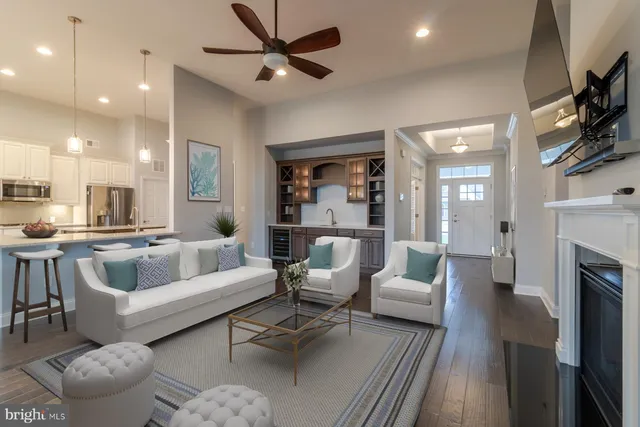 a view of a livingroom with furniture wooden floor and window