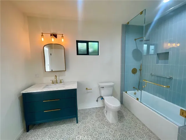 a bathroom with a toilet a sink and bathtub