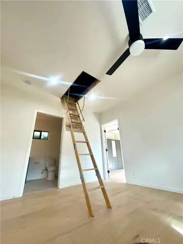 a view of an empty room with glass door