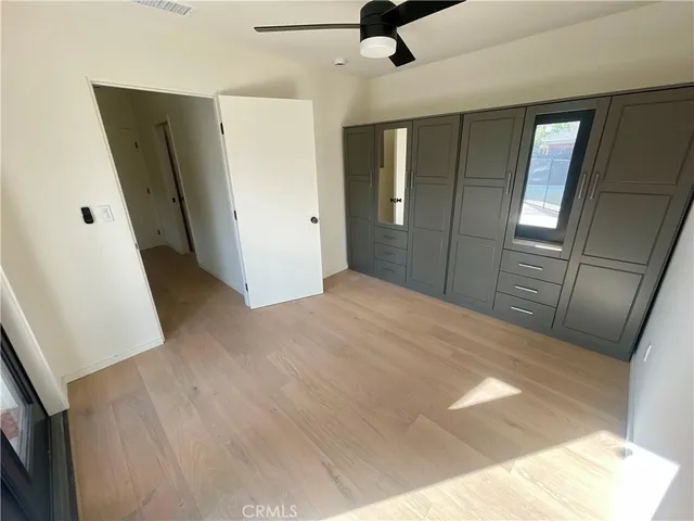 an empty room with a empty space and windows