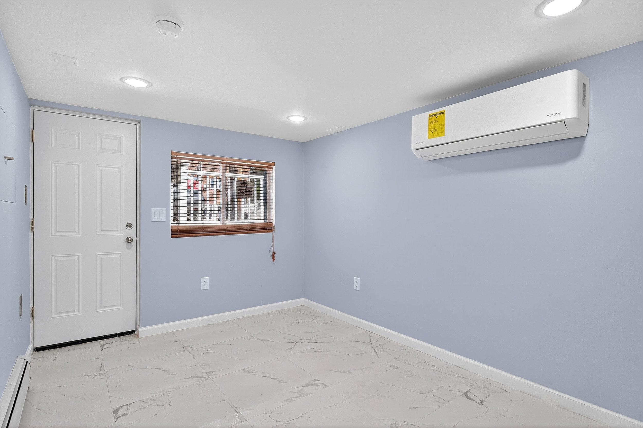 43 Sycamore Road, Unit 1 Jersey City, NJ 07305 - Photo 8 of 15 a view of a bedroom with window