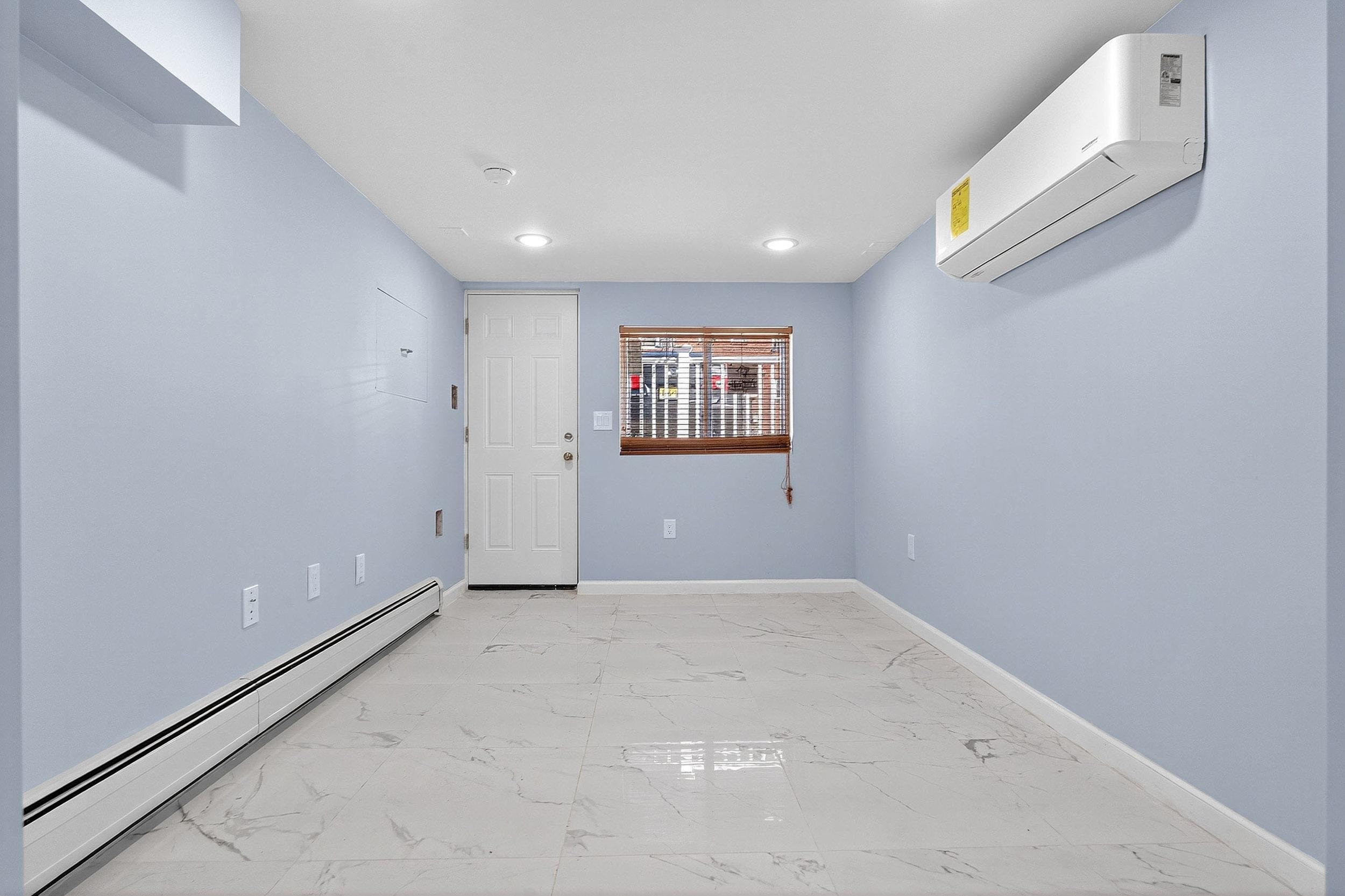 43 Sycamore Road, Unit 1 Jersey City, NJ 07305 - Photo 9 of 15 an empty room with windows