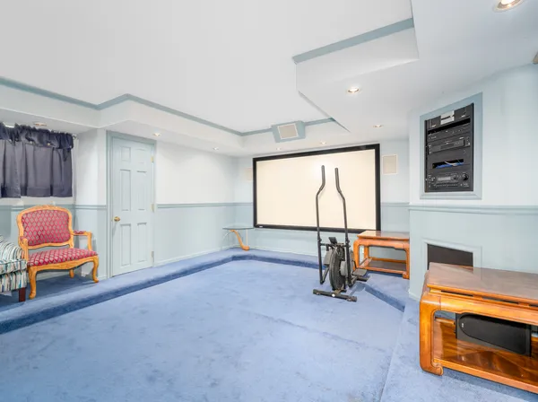 a view of a room with furniture and a window