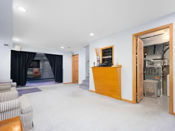 a room with furniture and a flat screen tv