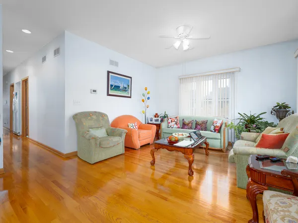a living room with furniture yard and a window