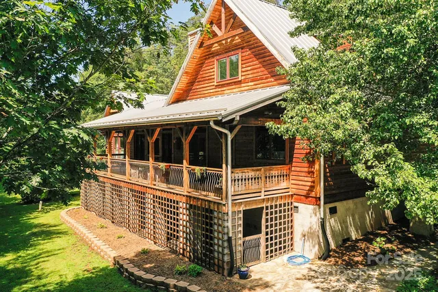 a view of house with backyard