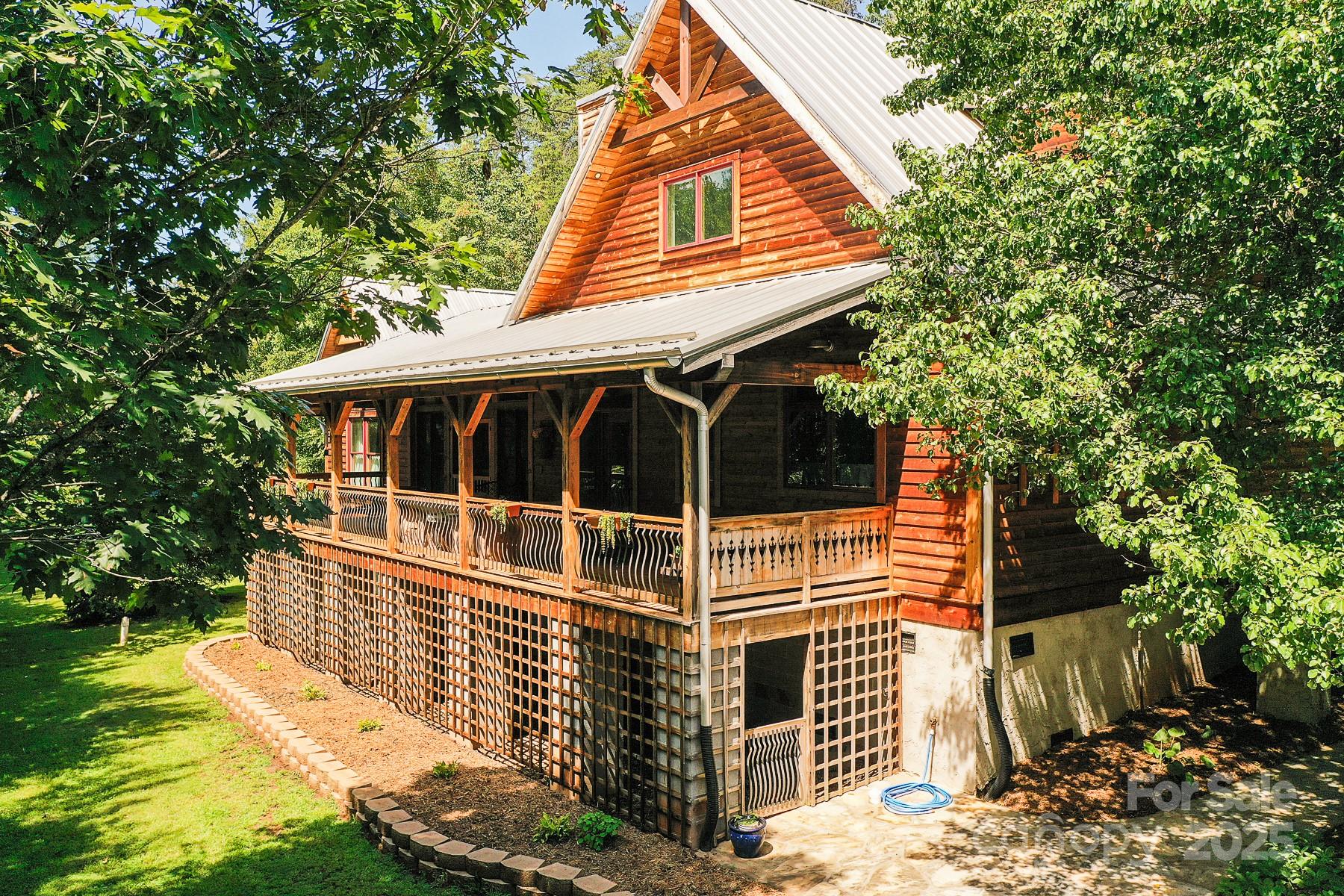 a view of house with backyard
