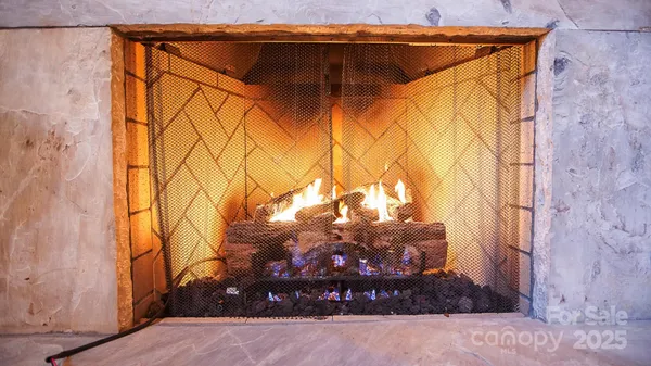 a view of a house with a snow in the background
