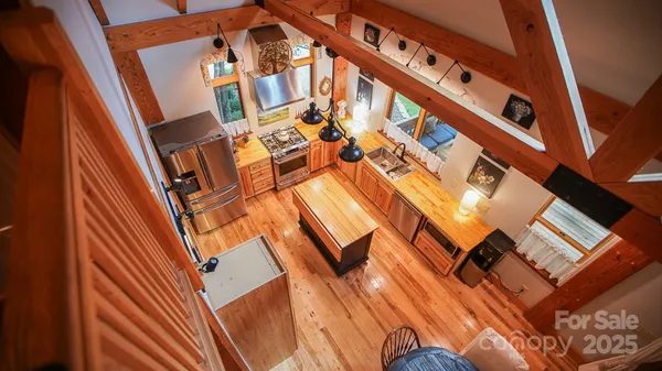 a view of an chairs and table in the balcony