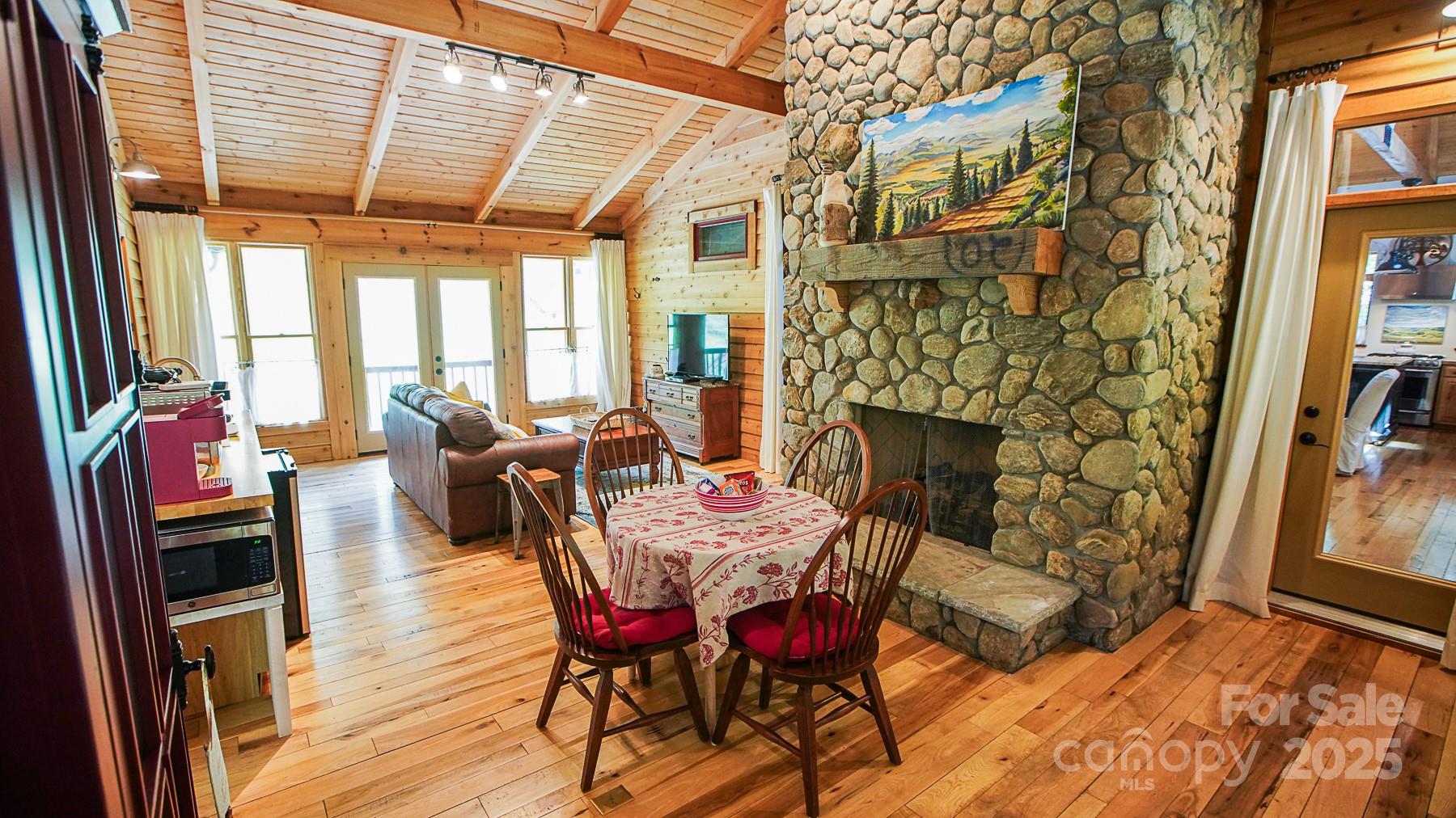 1048 South River Road Sylva, NC 28779 - Photo 22 of 42 a view of a dining room with furniture window and wooden floor