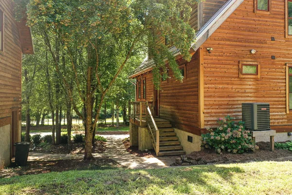 a view of a house with backyard porch and sitting area