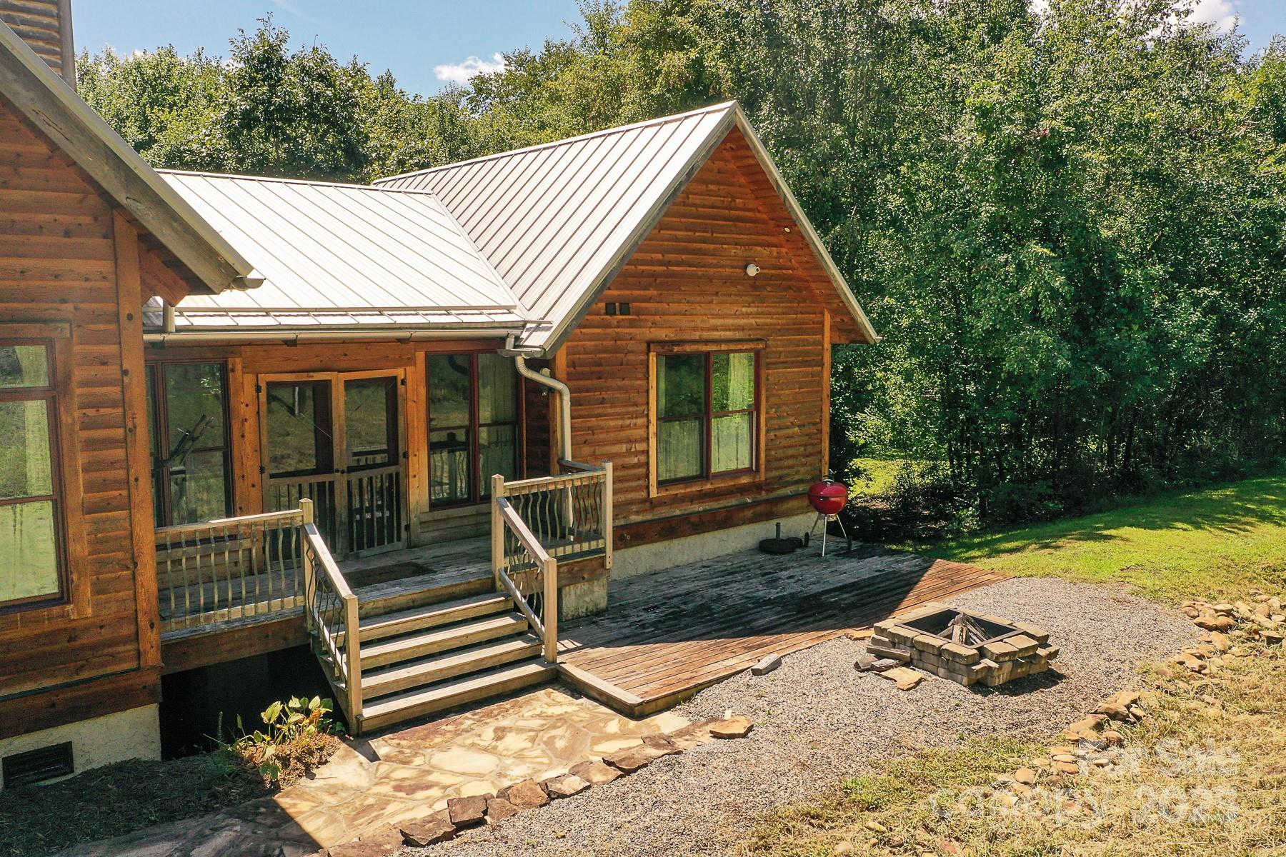 1048 South River Road Sylva, NC 28779 - Photo 29 of 42 a view of a house with backyard porch and sitting area